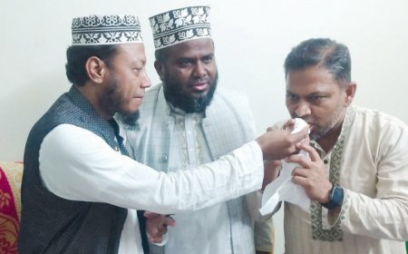 বিজয়ী হয়ে বিএনপি প্রার্থীকে মিষ্টি খাওয়ালেন জামায়াতের আমির হামজা